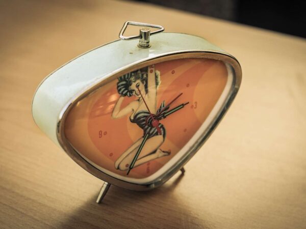 white and red alarm clock