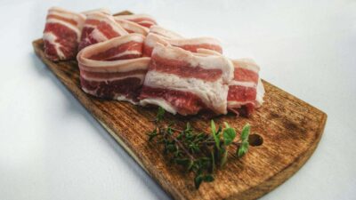 Food Photography of Sliced Bacon on Top of Brown Chopping Board